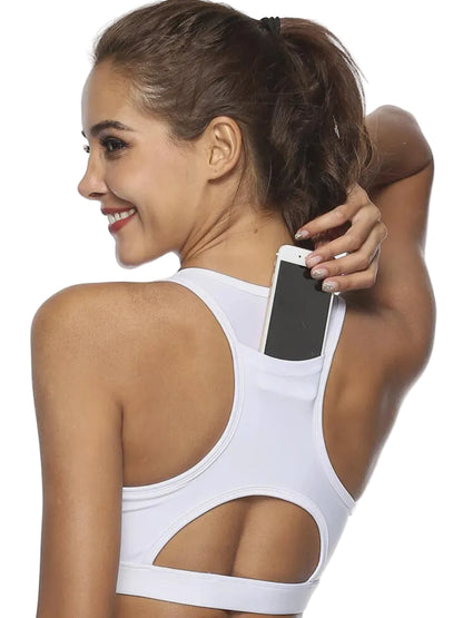 Women's racerback sports bra with built-in back phone pocket and breathable cutout for workouts